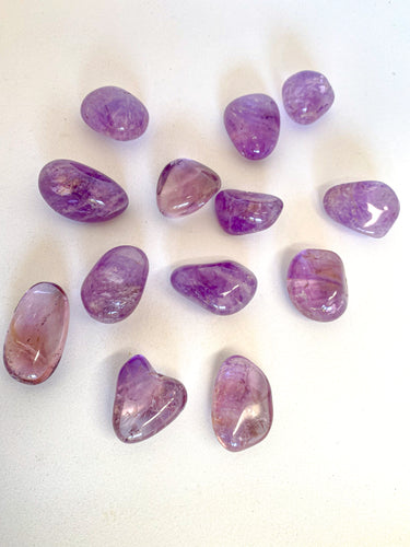 Amethyst Tumble Stones on White Background