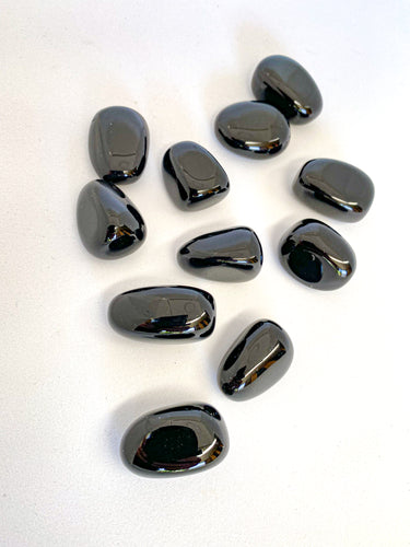 Black Obsidian Tumble Stones on white background