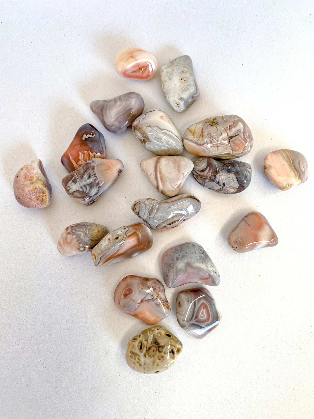 Pink Agate Tumble Stones on White Background