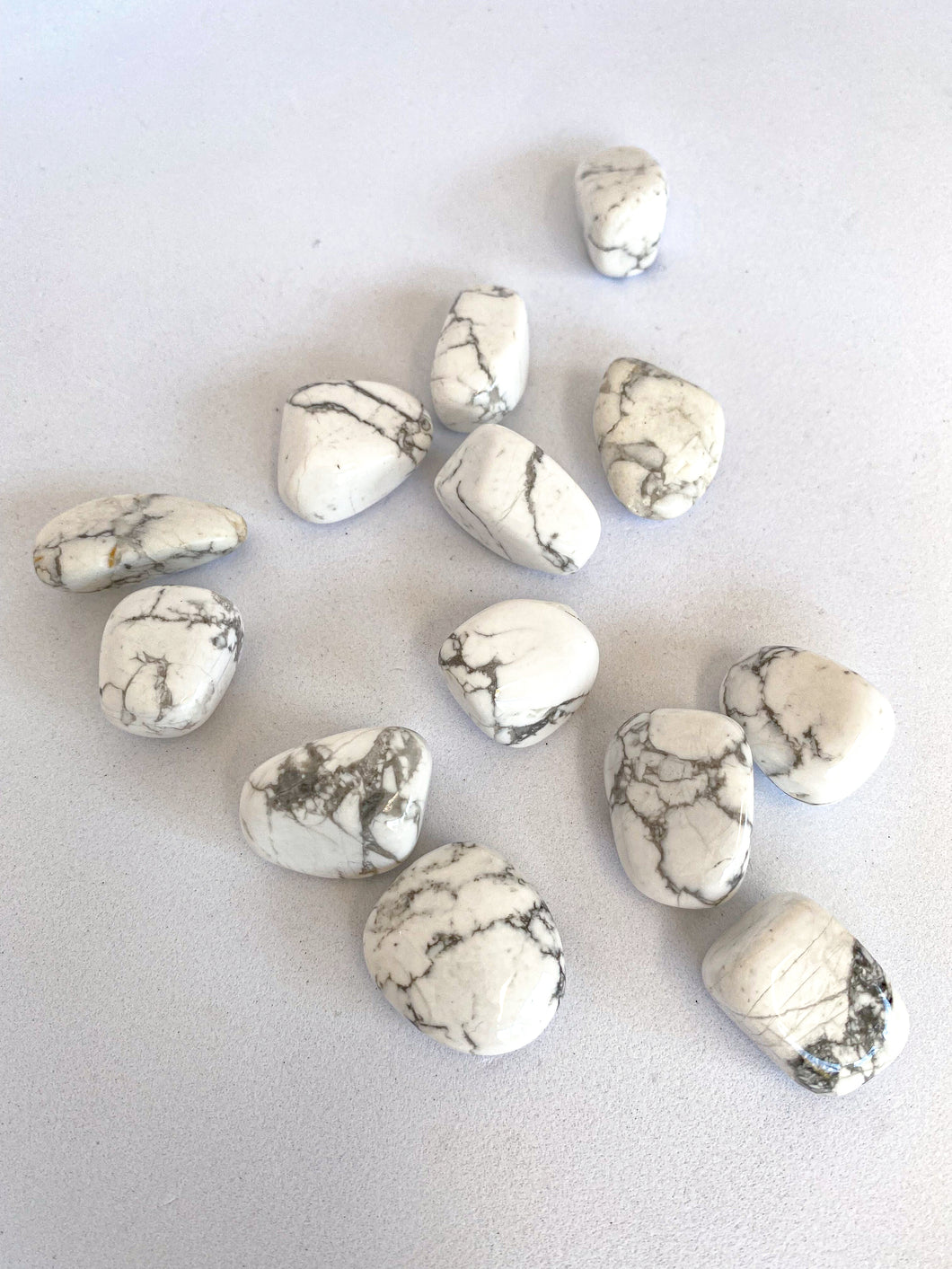 White Howlite Tumble Stones on White Background