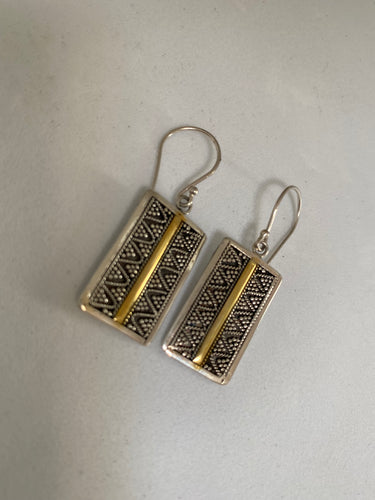 Silver and 12ct Gold earrings on white background