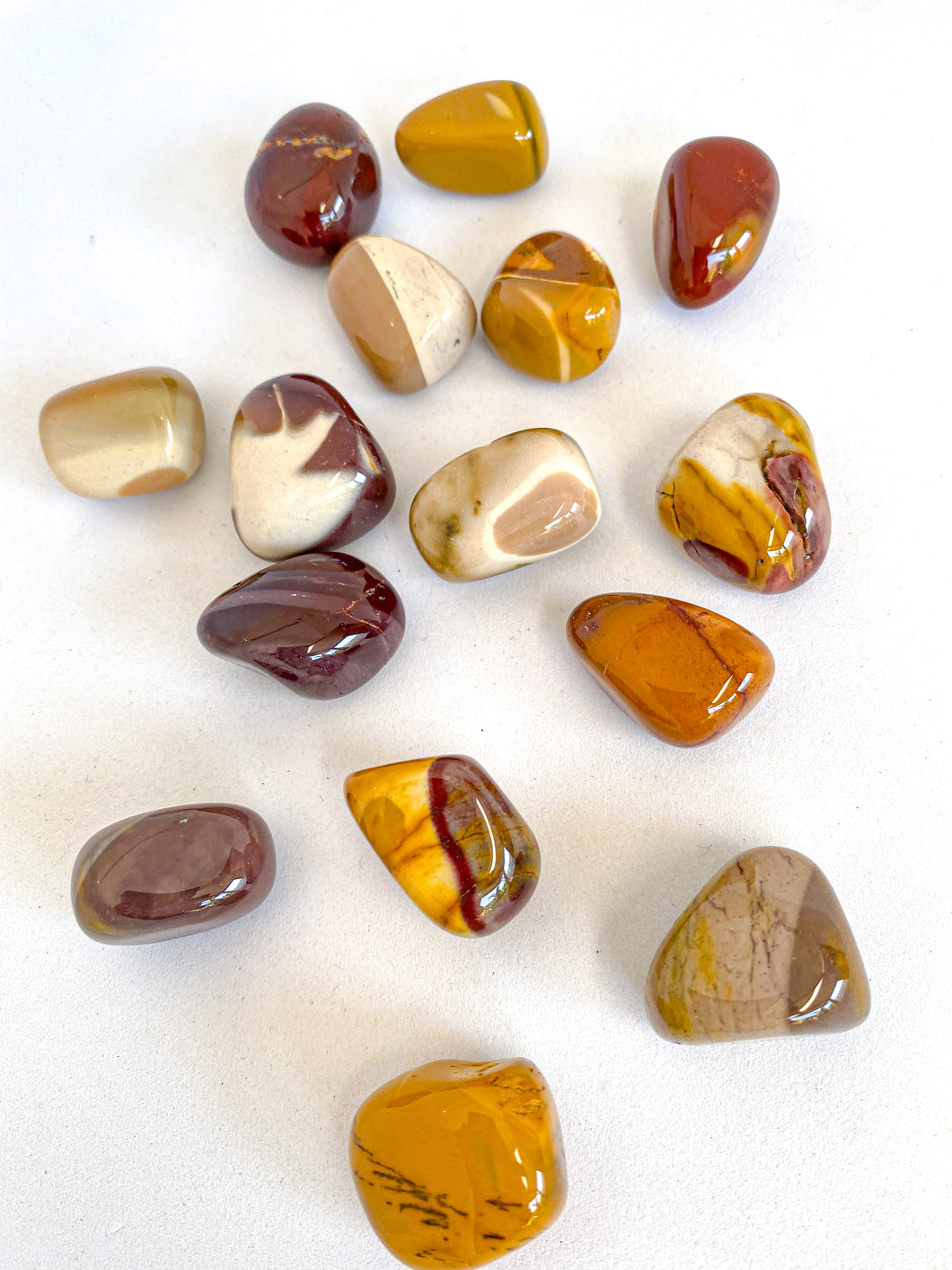 Mookaite Tumble Stones on White Background