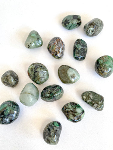 Emerald Tumble Stones on White Background
