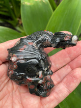 Load image into Gallery viewer, Plum Jasper Crystal skull on garden background
