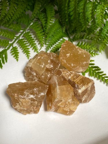 Honey Calcite Crystal rough on white background