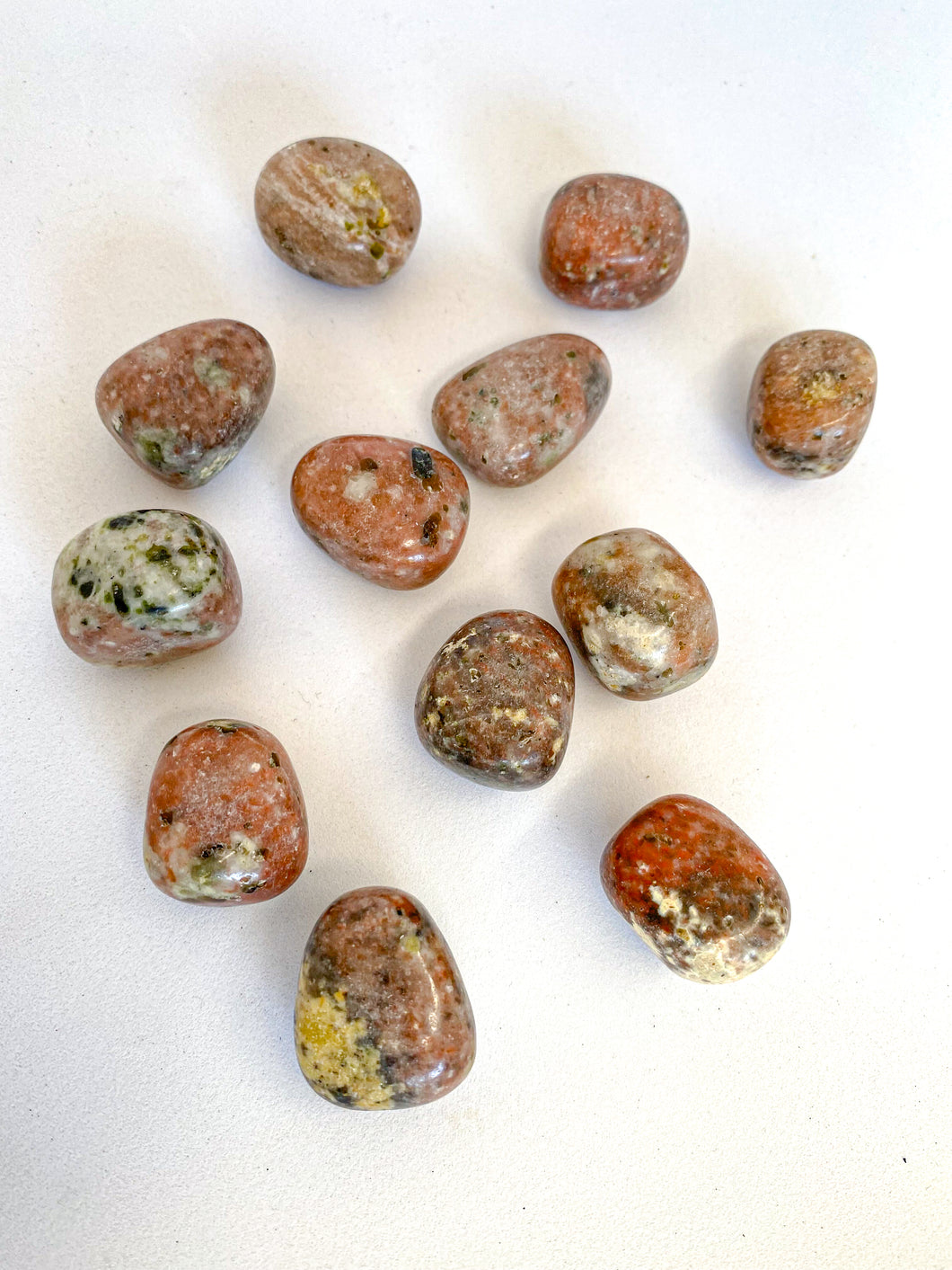 Pink Tourmaline Tumble Stones on White Background