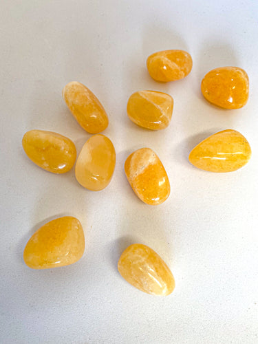 Yellow Calcite Tumble Stones on White Background